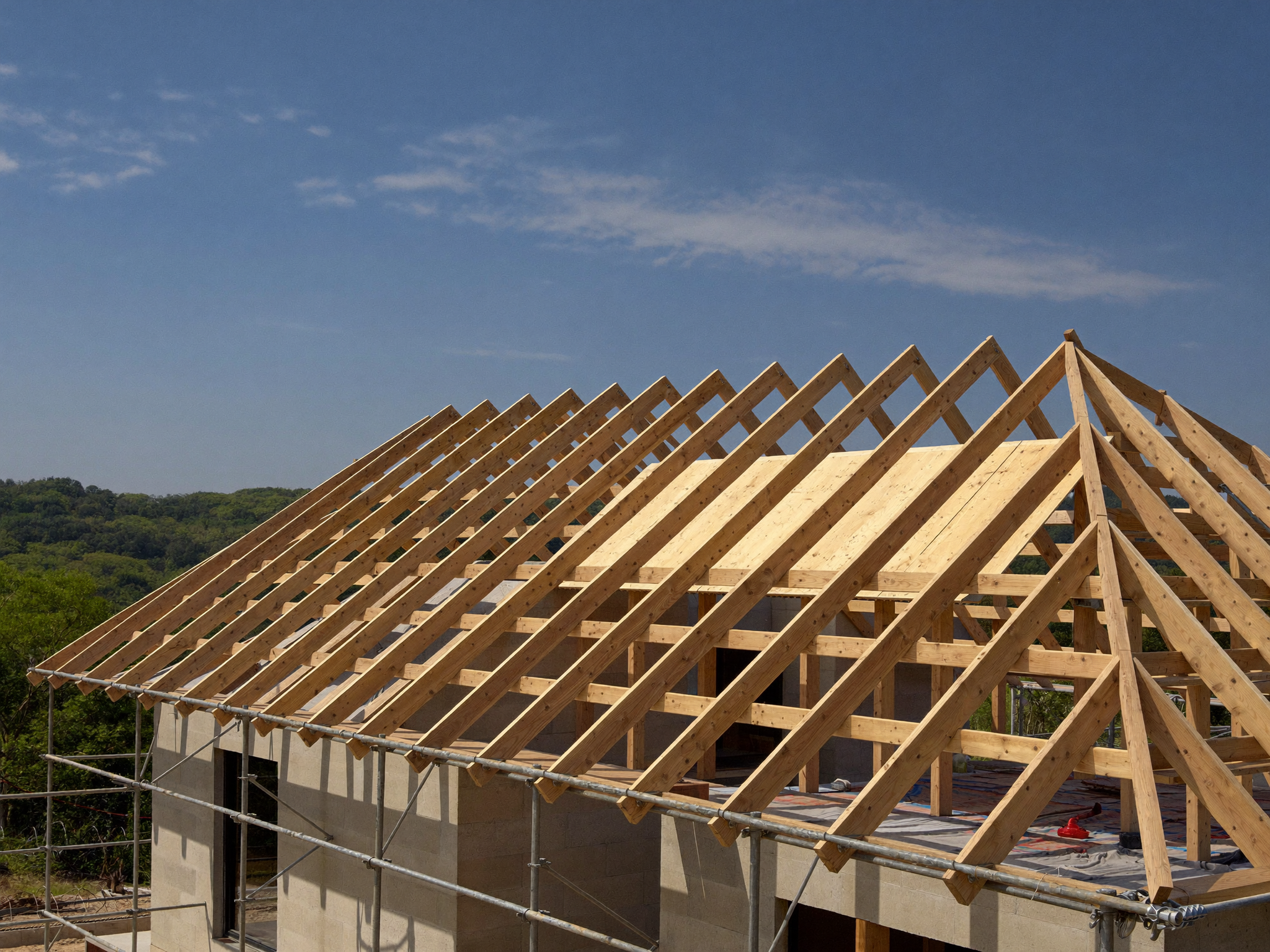 A custom home under construction at the roofing stage in North Carolina
